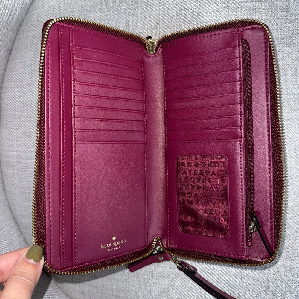 Kate Spade burgundy double zip wallet with wristlet attachment